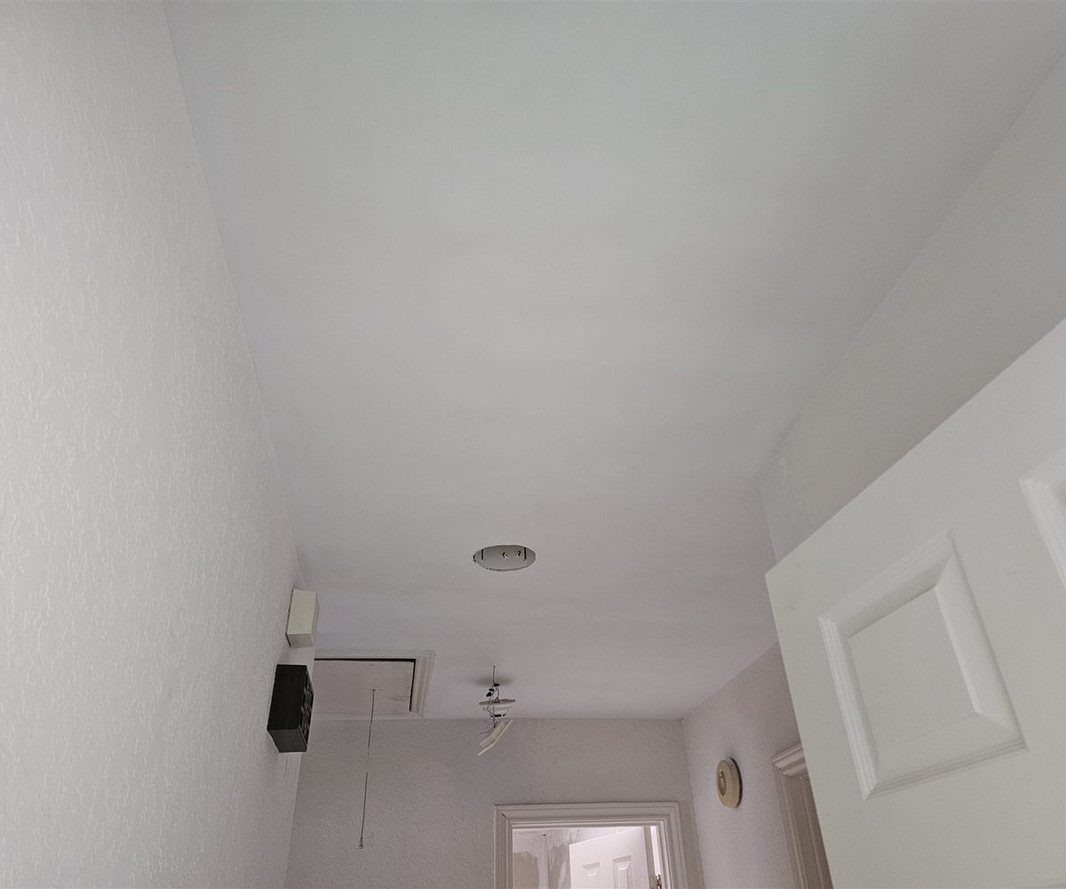 Smooth ceiling after texture removal and drywall finishing in DFW