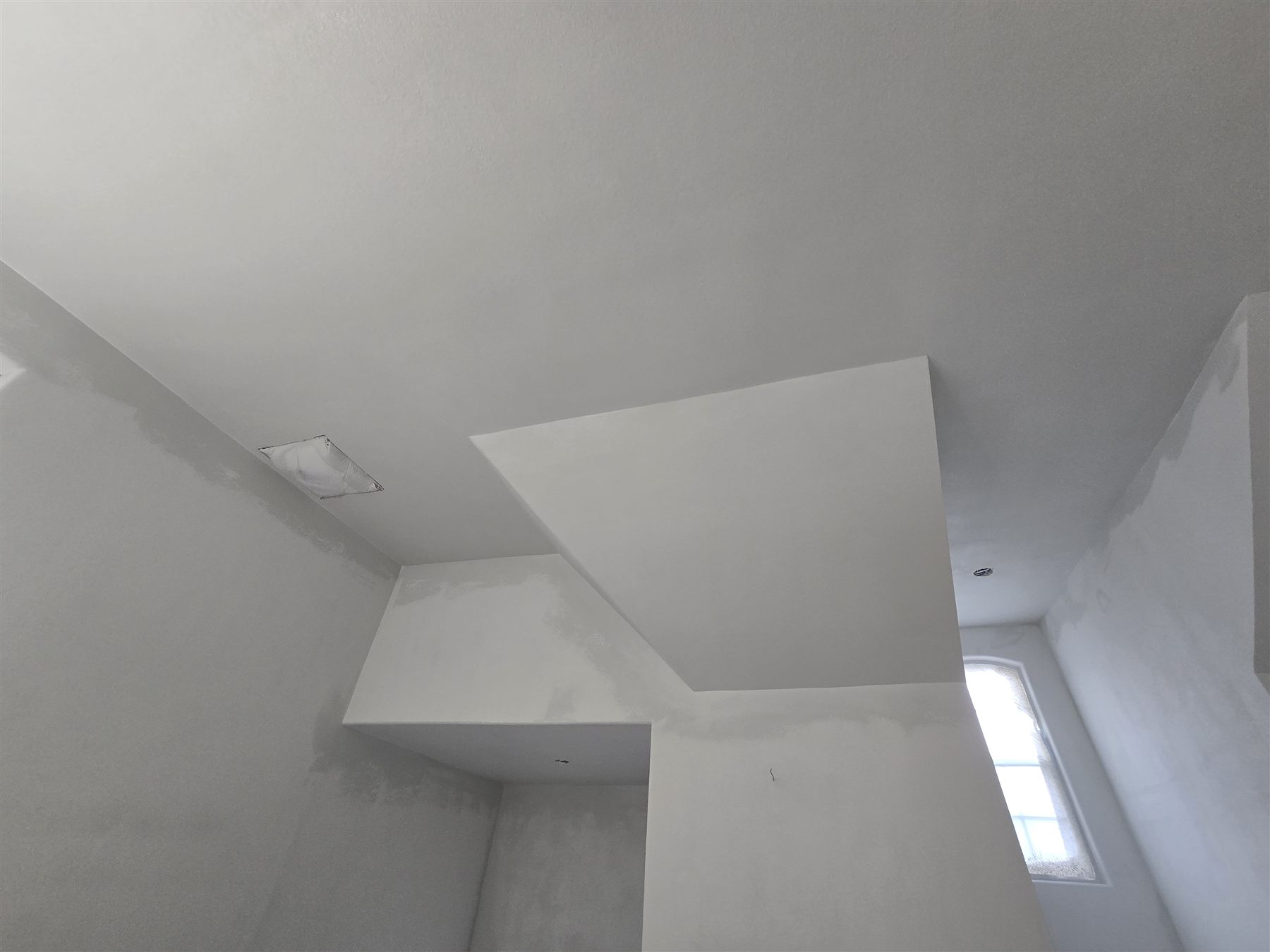 Interior drywall repair around ceiling angles in DFW home